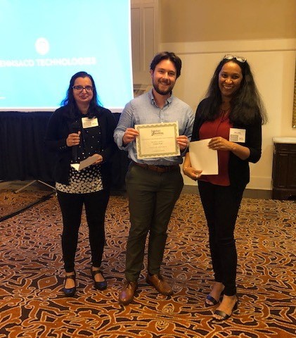 Second place student poster competition winner, Conner Pope, pictured with FIB committee members Priya Vooluthuru and Niki Labbe